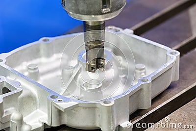 Operator milling automotive part by cabide milling Stock Photo