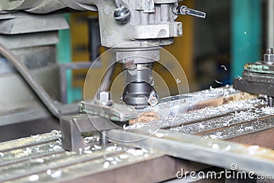 operator milling precision machine part by manual milling machine Stock Photo