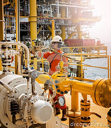 Operator recording operation of oil and gas process at oil and r Editorial Stock Photo