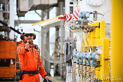 Operator recording operation of oil and gas process at oil and rig plant, offshore oil and gas industry, offshore oil and rig Stock Photo