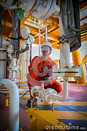Operator recording operation of oil and gas process at oil and r Editorial Stock Photo