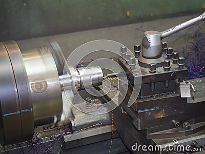 Operator turning mold parts by manual lathe Stock Photo