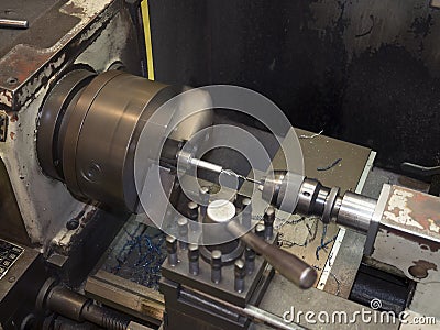 Operator turning mold parts by manual lathe Stock Photo