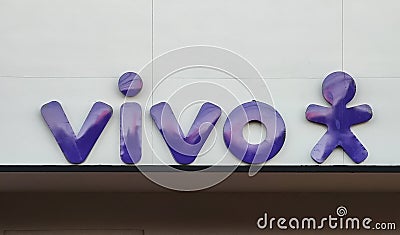 Operator Vivo logo facade store. Vivo is a trademark of TelefÃ´nica Brazil and a fixed telephony concessionaire. Editorial Stock Photo