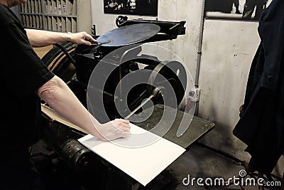 Operator at work on old typographic machine Stock Photo