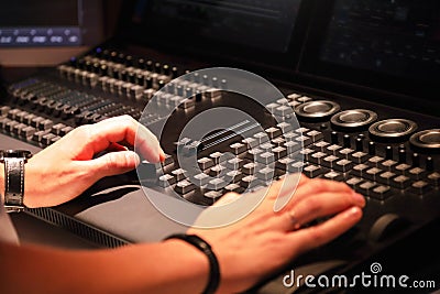 Working with stage lighting control console Stock Photo