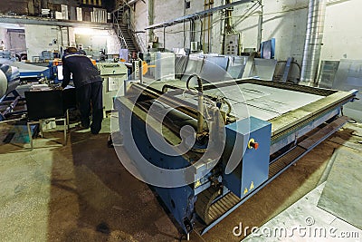Operator works with plasma cutting machine with program control Editorial Stock Photo