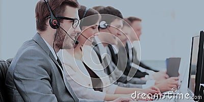 Operators with headsets in front of computers in the call center Stock Photo