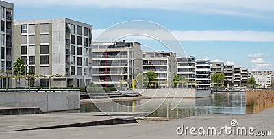 Opfikon, Switzerland - April 19th 2020: Artificial lake in the housing area of Glattpark Editorial Stock Photo