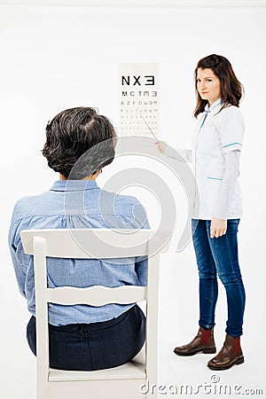 Ophtalmologist examining senior patient at sudio Stock Photo
