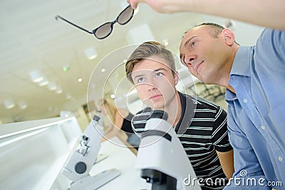 Ophtalmologist looking on pair glasses Stock Photo