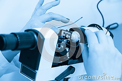 The ophthalmologist determines the optical power of the spectacle lenses and the lens centers on the optical stand. Stock Photo