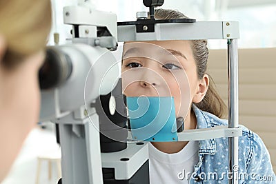 Ophthalmologist examining little girl Stock Photo