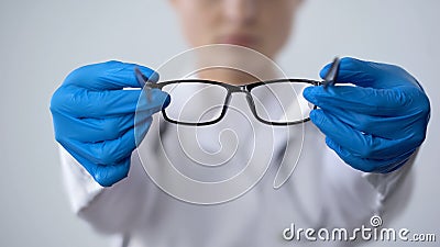 Ophthalmologist offering glasses, treatment and correction of eyesight, health Stock Photo