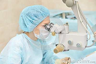 Ophthalmology laser microscope operation. Doctor in clinic. Patient eye treatment. Myopia and cataract removal Stock Photo