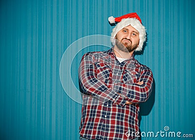 The opinionated christmas man wearing a santa hat Stock Photo