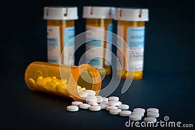 Opioid Crisis - Open Bottle of Prescription Painkillers. Medicare, overdose. Stock Photo