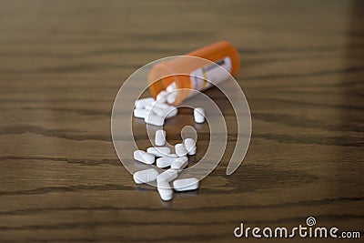 White Opioid Painkillers Spilled on Table Stock Photo