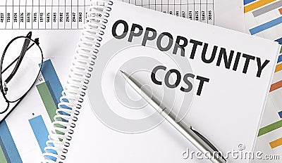 OPPORTUNITY COST text , pen and glasses on the chart Stock Photo