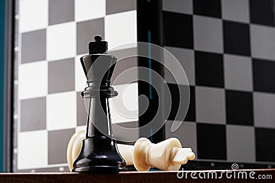 opposition of King chess piece against chess board Stock Photo