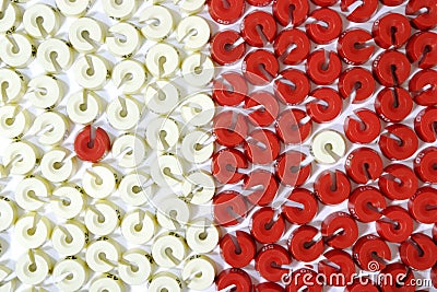 An opposition of red and white size washers Stock Photo