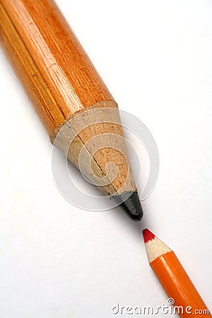 Opposition of a small and greater pencil Stock Photo