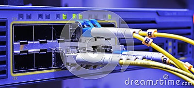 Optic fiber cables connected to data center Stock Photo
