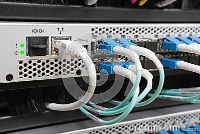 Optic fiber cables connected to switch Stock Photo