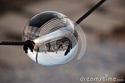 Optical illusions in a crystal sphere Stock Photo