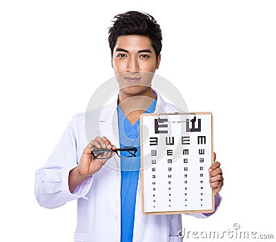 Optician doctor holding with eyechart and glassesa Stock Photo