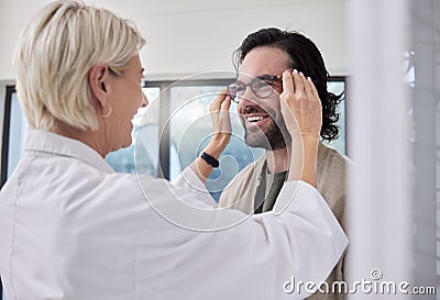 Optician, glasses and man in store for vision, eyesight and optical frames. Happy customer face, optometrist and lenses Stock Photo