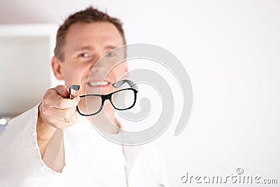 Optician offering glasses Stock Photo