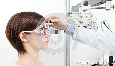 Optician with trial frame, optometrist doctor examines eyesight Stock Photo