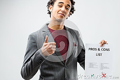 Optimist considering the pros in the list Stock Photo