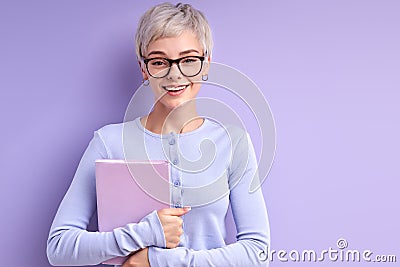 Optimistic cheerful lady in eyeglasses is ready to study, to go university Stock Photo