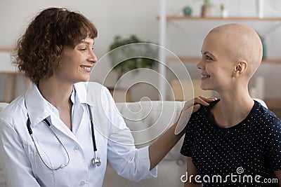 Female doctor oncologist consulting young woman receiving cancer treatment. Stock Photo