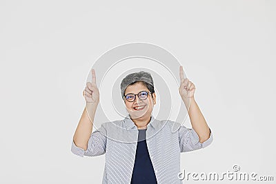 Merry Asian woman pointing away Stock Photo