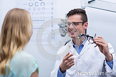 Optometrist discussing on messbrille with female patient Stock Photo