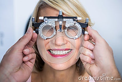 Optometrist examining female patient with messbrille Stock Photo