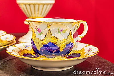 Opulent gold decorated tea cup masterwork Meissen porcelain Germany Editorial Stock Photo