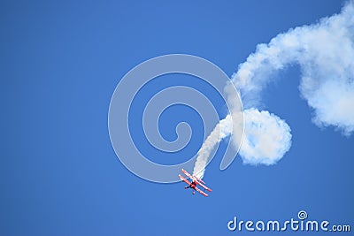 Oracle Stunt airplane performing a corkscrew Editorial Stock Photo
