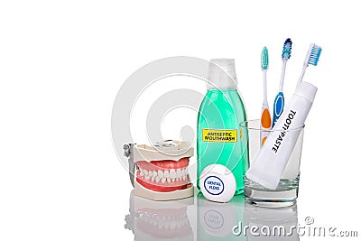 Oral care essential products tapered toothbrush, toothpaste, mouthwash, dental floss Stock Photo