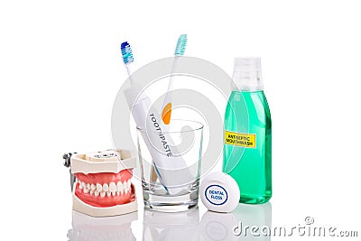 Oral care essential products tapered toothbrush, toothpaste, mouthwash, dental floss Stock Photo