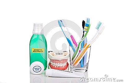 Oral care essential products tapered toothbrush, toothpaste, mouthwash, dental floss Stock Photo