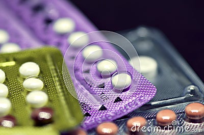 Oral contraceptive pill on black background. Stock Photo