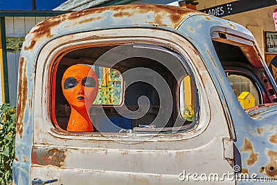 Orange Alien on Main Street in pickup truck, Seligman on historic Route 66, Arizona, USA, July 22, 2016 Editorial Stock Photo