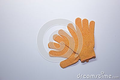 Orange bath gloves on white background Stock Photo