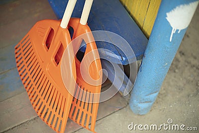 Orange broom. Cleaning tool. Garden tool Stock Photo