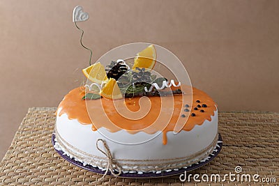 Orange cake with decoration on it Stock Photo
