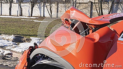Orange car crash background. Close-up detail of auto wreck. Front side of crashed car from accident. Car accident Stock Photo